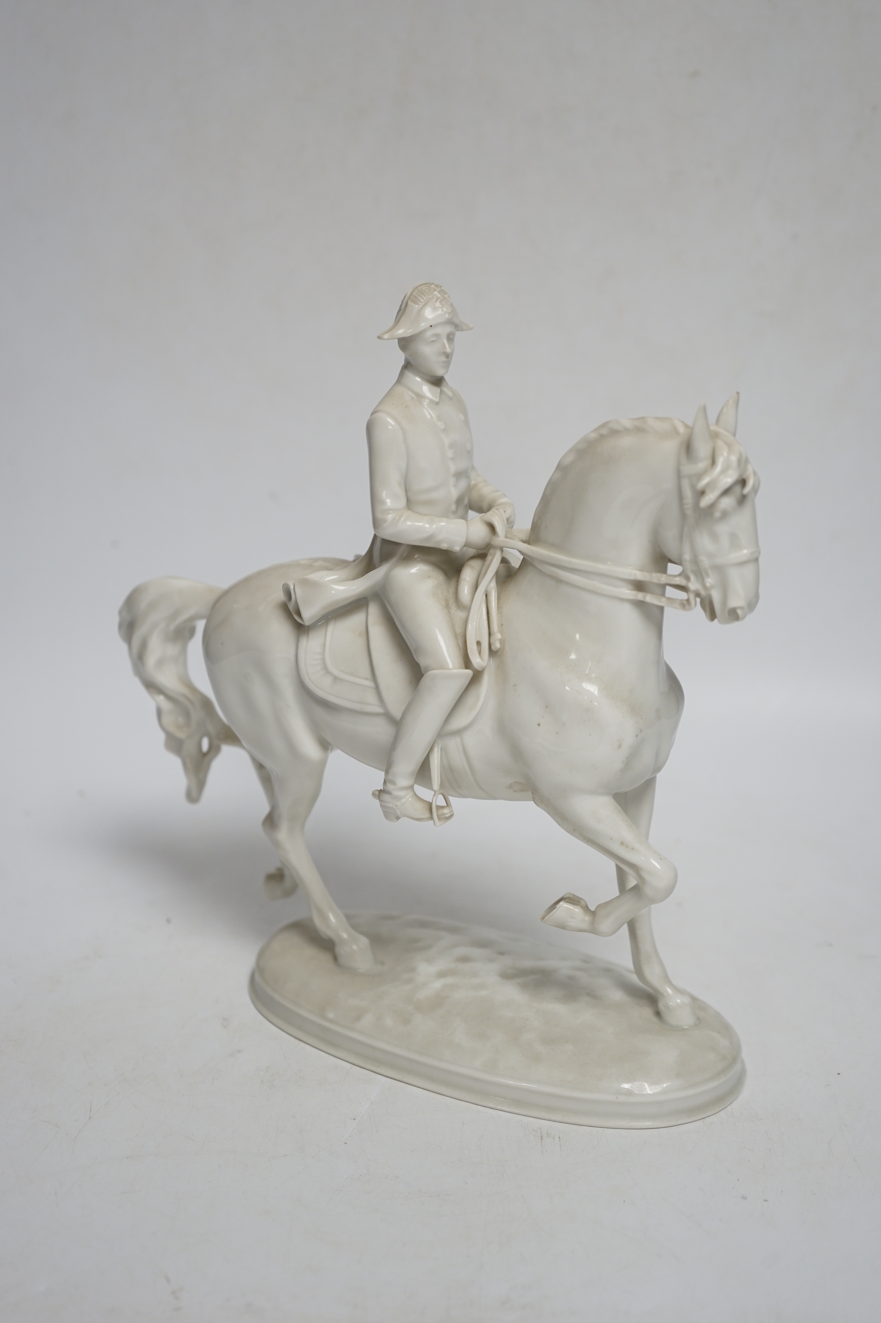 An Augarten, Wien white glazed porcelain Spanish Riding School Group, 24cm